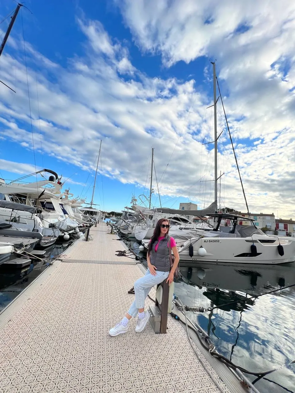 Diana Moss walking through Port Grimaud marina